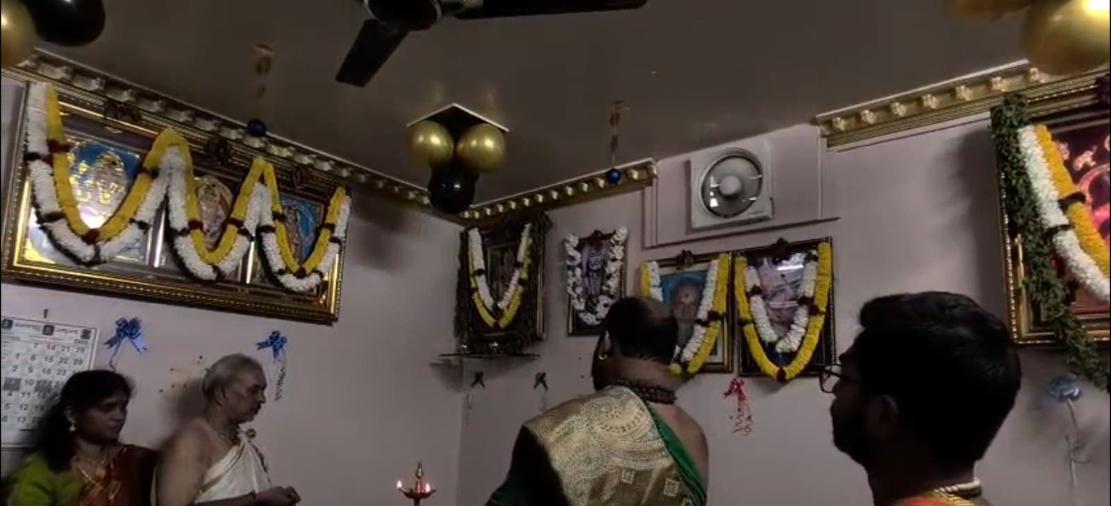 Priest and staff at the Sree Ayyappa Tourist office during a pooja ceremony