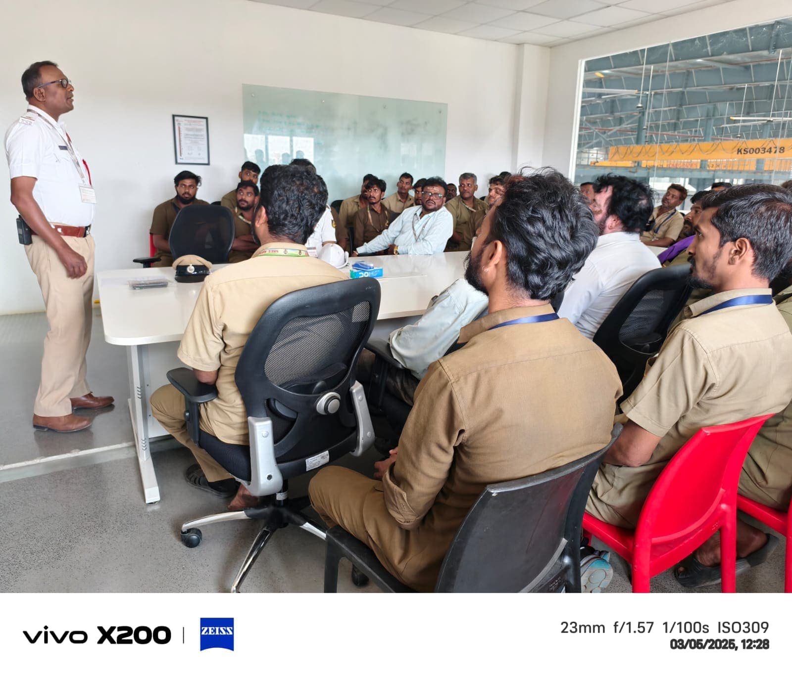 Drivers attending a weekly traffic police road safety briefing at a client site in Bangalore